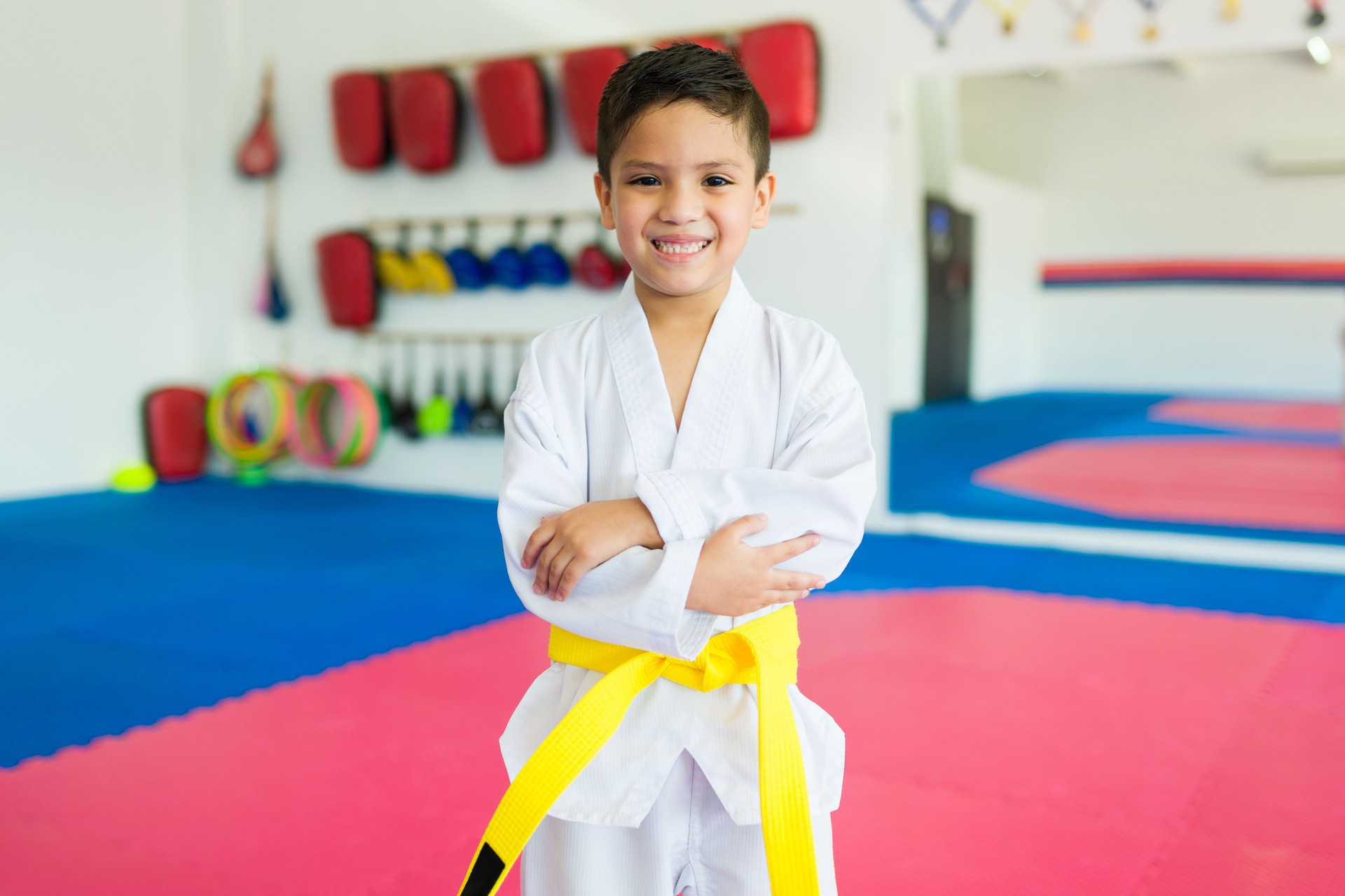 Cheerful kid enjoying learning martial arts